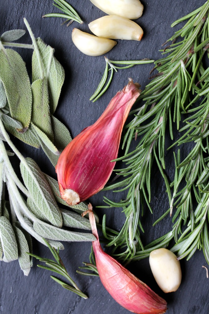 flat-lay image of fresh herbs for cheesy garlic herbed mashed potatoes