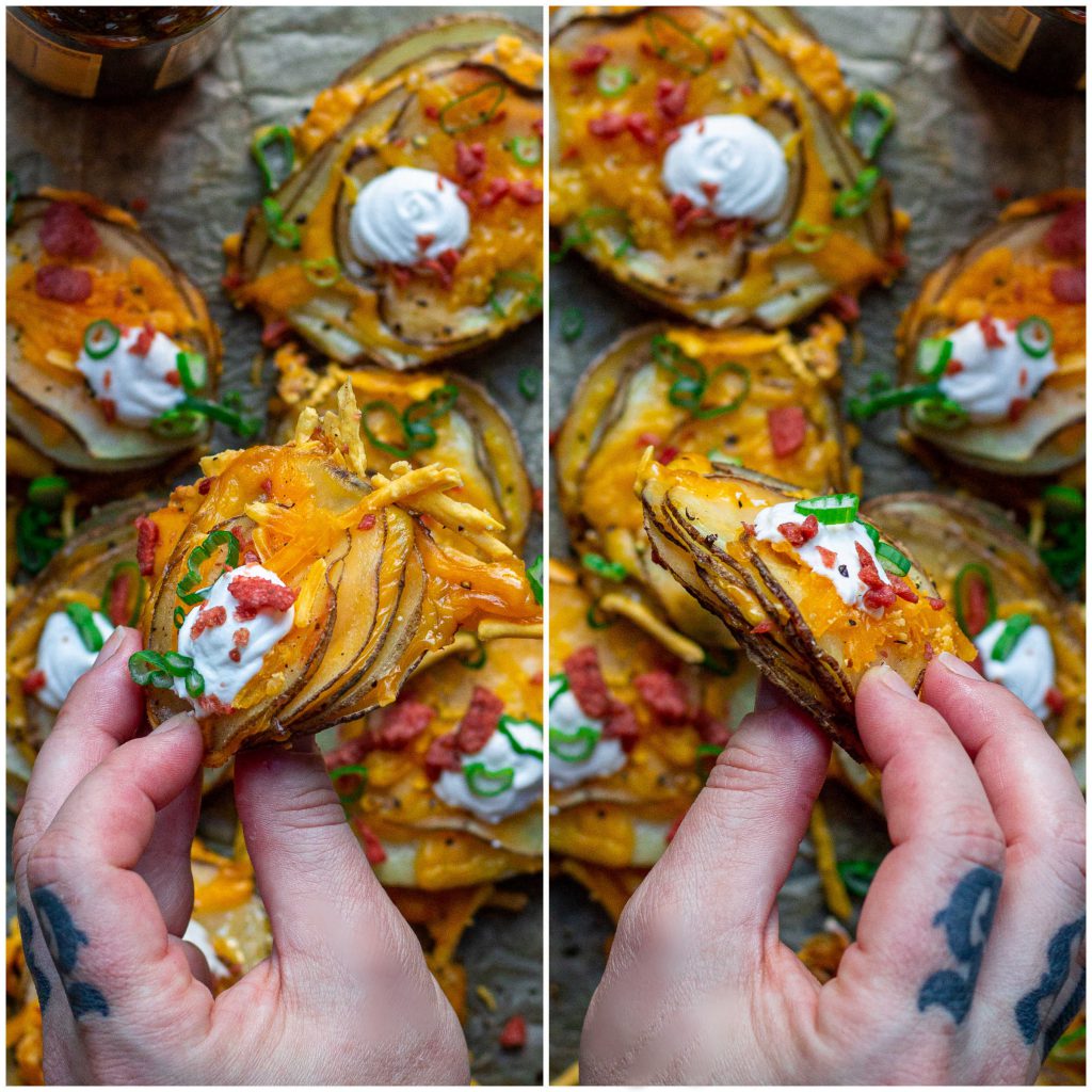A platter of cheesy loaded potato stacks garnished with sour cream, bacon bits and chives, ready to serve.