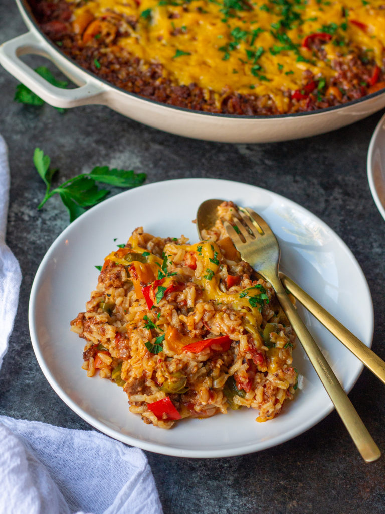 A serving of unstuffed pepper skillet garnished with fresh parsley, ready to be enjoyed.