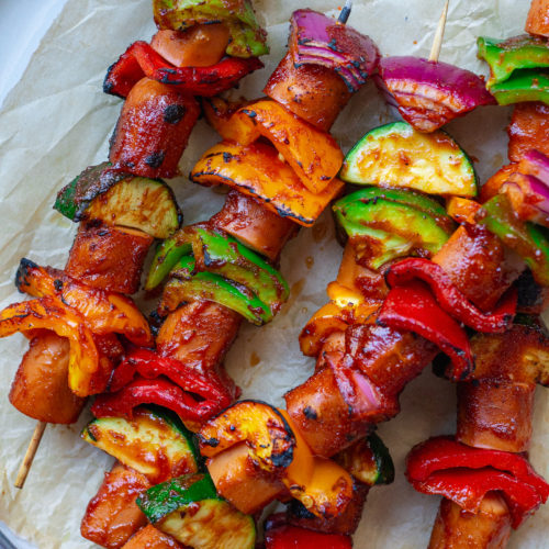 vegan hot dog skewers with vegetables and sriracha glaze