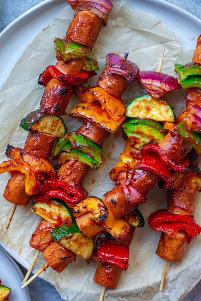 vegan hot dog skewers with vegetables and sriracha glaze