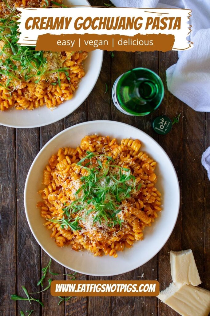 Final presentation of the Creamy Gochujang Pasta, garnished with vegan parmesan shreds and fresh cilantro micro greens 