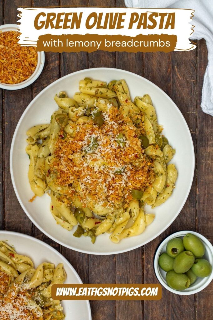 A plate of Vegan Green Olive Pasta garnished with vegan parmesan and fresh minced parsley