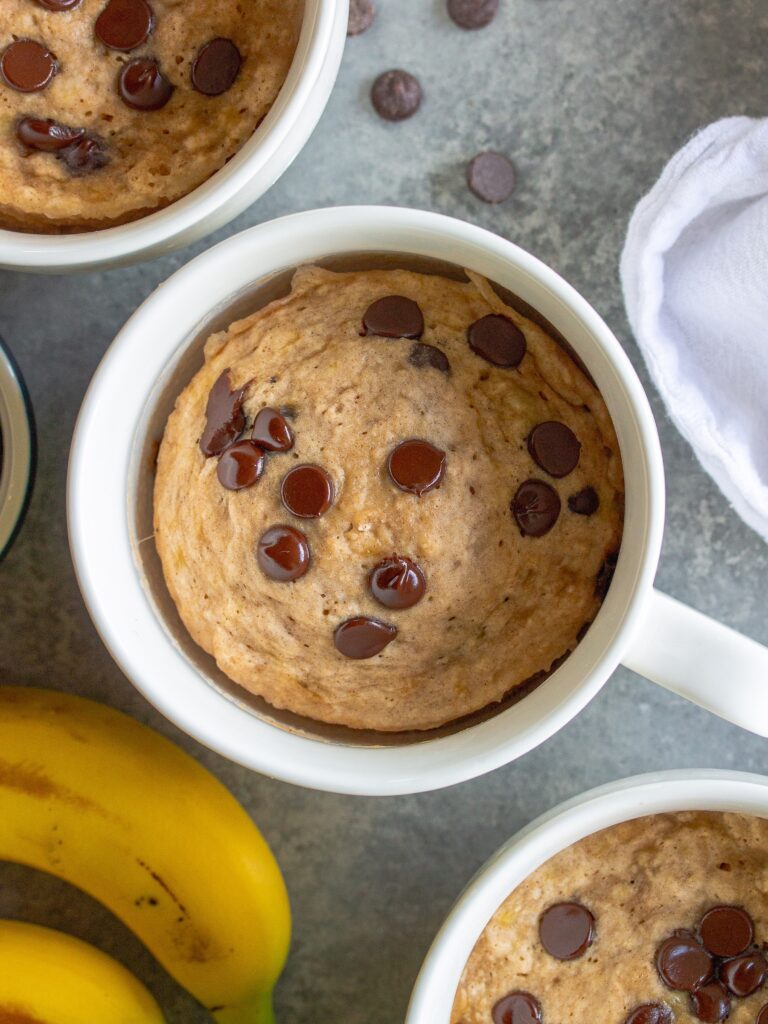 Optional toppings on the finished mug cake, including chocolate chips, for added visual appeal.