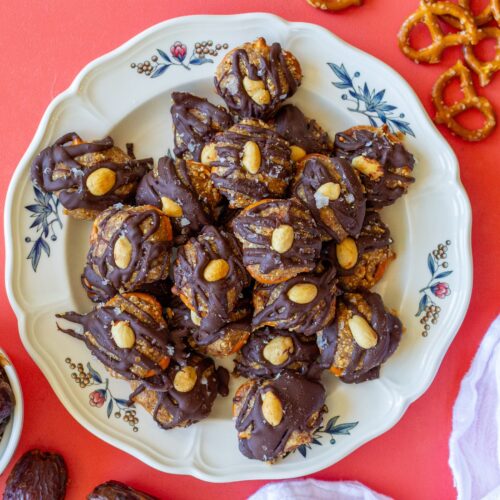 Finished Chocolate Peanut Butter Pretzel Bites topped with flakey salt and additional peanuts, ready to be enjoyed as a delicious snack.