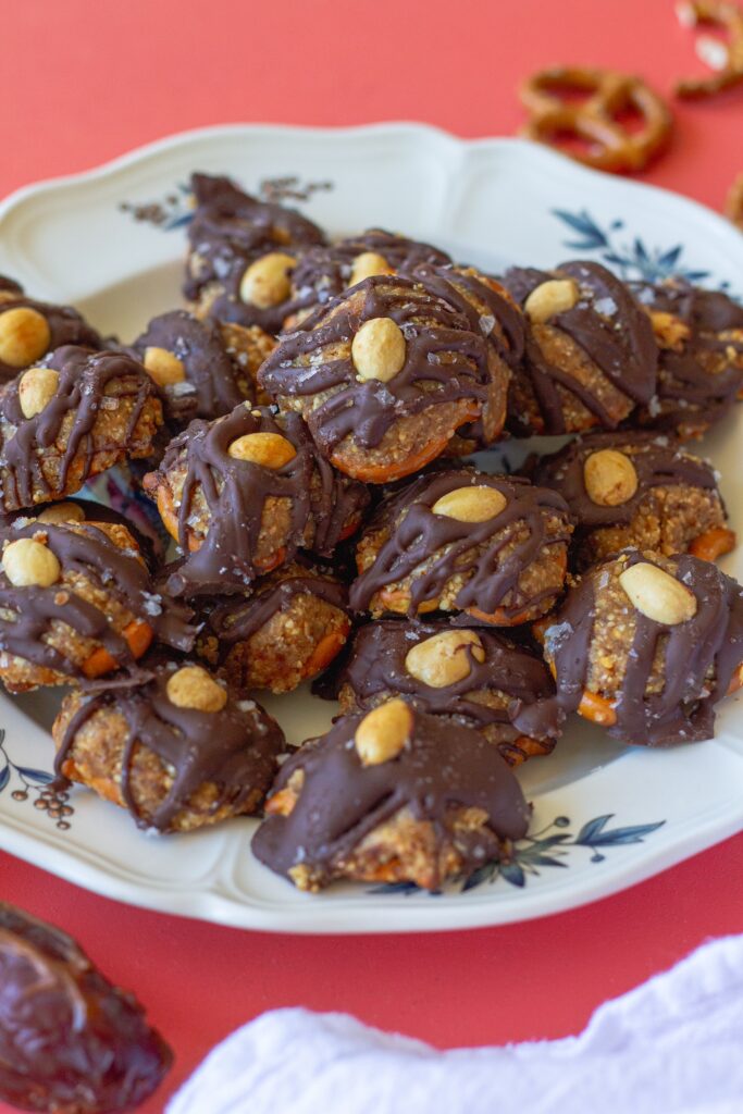 Finished Chocolate Peanut Butter Pretzel Bites topped with flakey salt and additional peanuts, ready to be enjoyed as a delicious snack.