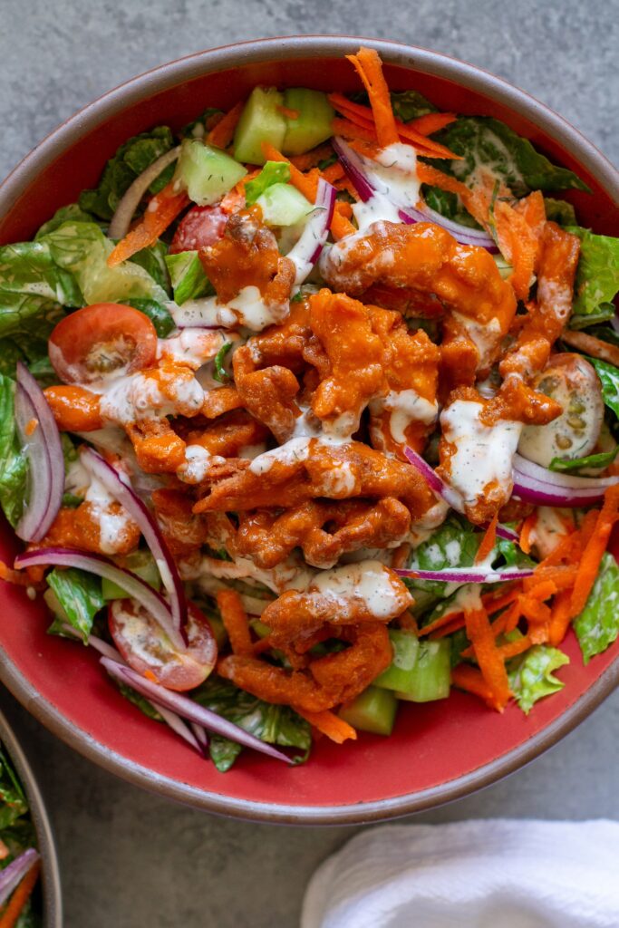Buffalo Chicken Salad in a bowl, garnished with fresh dill.