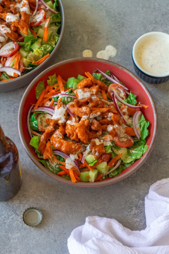Buffalo Chicken Salad in a bowl, garnished with fresh dill.