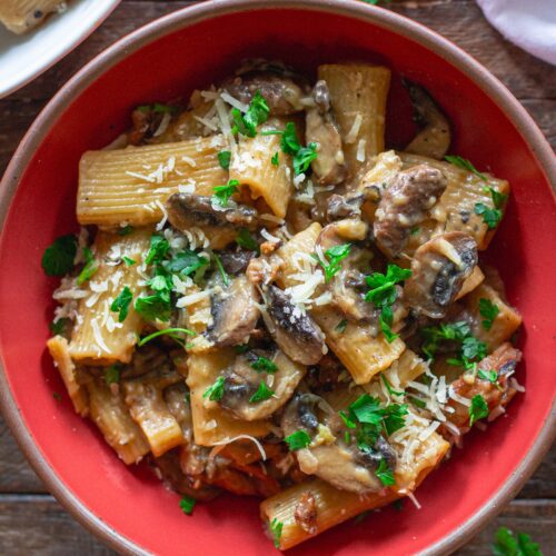 Close-up of creamy mushroom marsala pasta garnished with fresh parsley