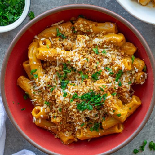 Bowl of creamy hidden veggie pasta topped with golden garlicky breadcrumbs and fresh parsley.