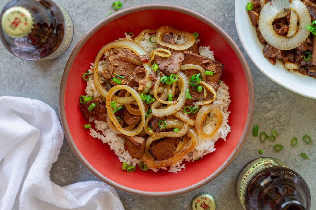 Vegan bistek tagalog with braised tofu and caramelized onion rings served over steamed rice.