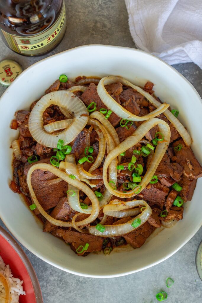 Vegan bistek tagalog with braised tofu and caramelized onion rings served over steamed rice.